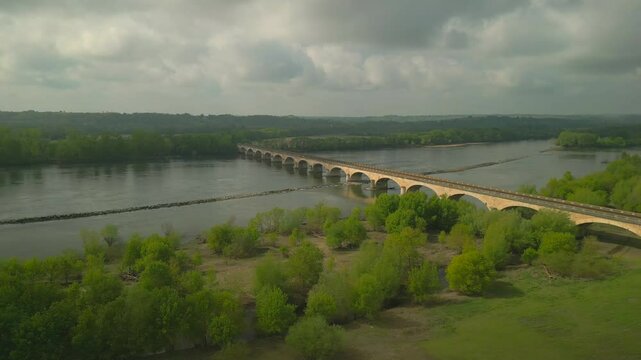 SNCF railway bridge in France's countryside passes over the Loire River.