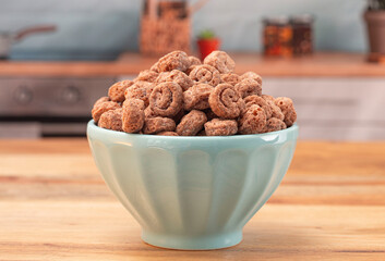 Swiss Roll Flavored Breakfast Cereal on a Wood Kitchen Cabinet