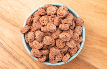 Swiss Roll Flavored Breakfast Cereal on a Wood Kitchen Cabinet