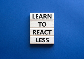 Learn to react Less symbol. Wooden blocks with words Learn to react Less. Beautiful deep blue background. Business and Learn to react Less. Copy space.