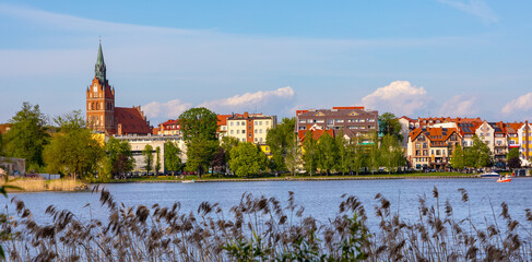 Panoramic view of Elk town with Holiest Heart of Jesus neo gothic church at Jezioro Elckie Lake in Mazuria lakeland region of Poland