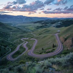 Aerial View of Highway Curving Through Autumn Hills