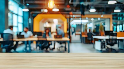 Obraz premium Empty desk in modern office background. Wooden table with blurred background of modern open space office with business people working, perfect for product placement