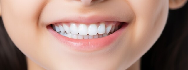 Obraz premium baby smile close. white teeth of a child isolated on a white background