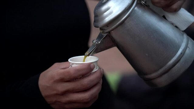 Video of traditional Arabic or Saudi coffee at a family gathering.