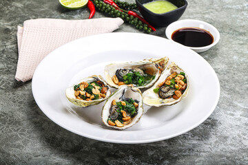 Open half oysters with green onion