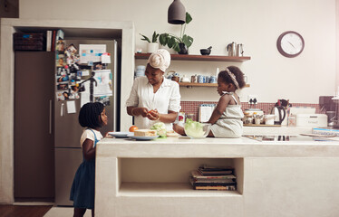 Black family, mom and children in kitchen for cooking nutrition, tomato sandwich and bonding together in home. African mama, kids and food for eating with vegan health, lunch meal and parent support