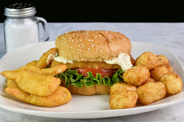 fish sandwich  with beer battered shrimp and tater tots