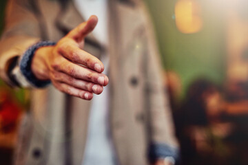 Closeup, handshake and man with greeting, cafe and welcome with agreement, introduction and thank you. Person, shaking hands or guy in restaurant, hello and friendly with trust, polite or cooperation