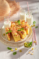 Sweet gooseberry butter cake served in sunny summer kitchen.