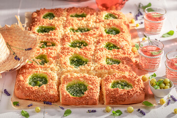 Homemade and delicious gooseberry yeast cake served with lemonade.
