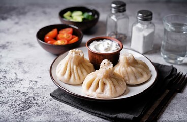 Khinkali with cream sauce in a plate