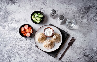 Khinkali with cream sauce in a plate