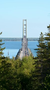 Mackinac Bridge with heavy traffic while two lanes closed during Holiday Weekend