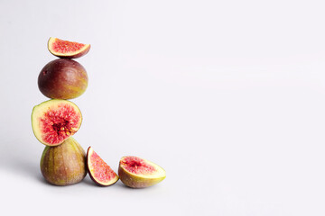Fresh ripe figs on white background