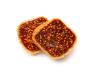 Cut sweet dried fig on white background