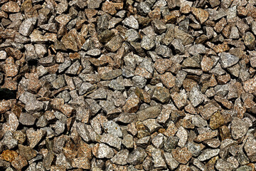 A photo of a ground covered with crushed stone for use as background material