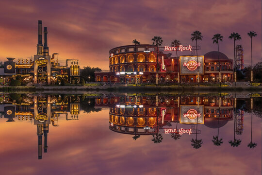 Universal studios and city walk in Orlando Florida, Hard Rock at dusk restaurant reflected in the lake. Tourist destination for Universal Studios and Islands of Adventure. 