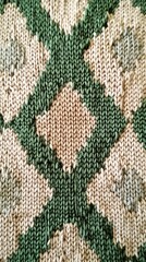 Woven fabric with green and beige diamond pattern, close-up view