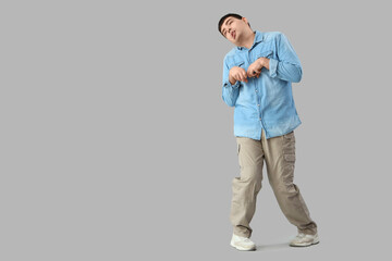 Young man on light background. National Cerebral Palsy Awareness Month