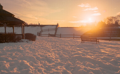 river dam in winter at sunset
