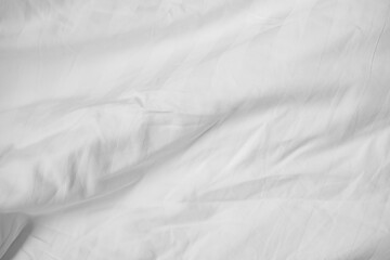 Abstract White Bedding Sheets or White wrinkled fabric background texture and Texture with copy-space :Creased or wrinkled white fabric,Soft focus