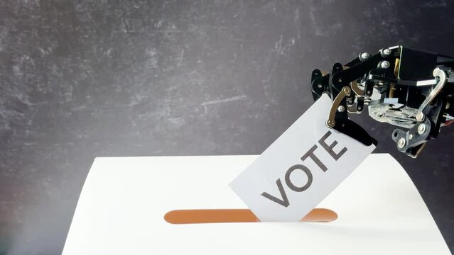A hand displays "Fake News" and "Vote" cards, while a robotic arm interacts with a ballot in a voting slot.