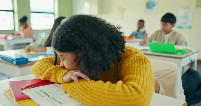 Student, desk and girl for tired in classroom, homework or activity with sleeping learner in lesson. Education, childhood development and burnout, fatigue or female person in junior school with test