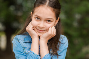 Portrait of beautiful little girl outdoors. Cute child
