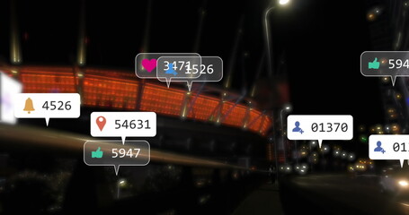 Image of social media icons floating against city traffic at night