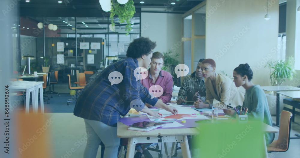 Poster image of message icons floating against diverse colleagues discussing over documents at office