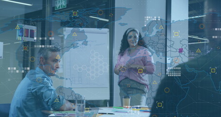 Image of world map and data processing against biracial woman giving a presentation at office