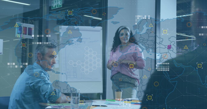 Image of world map and data processing against biracial woman giving a presentation at office