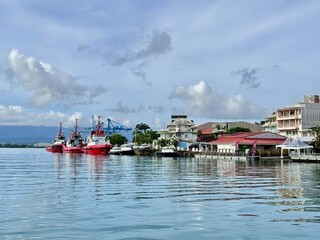 view of boats and a cargo ship docked at the port of Pointe à Pitre in Guadeloupe in the French...