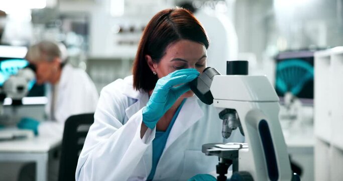 Examine, microscope and science with woman in laboratory for medical discovery or experiment. Breakthrough, innovation and research with scientist at work on cure or vaccine for biology study