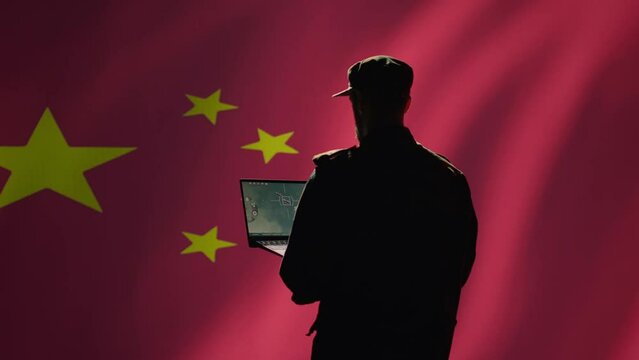Chinese soldier using radar detecting ballistic missile attacks and conducting general space surveillance and satellite tracking. CCP agent using military laptop software preventing rockets, camera B