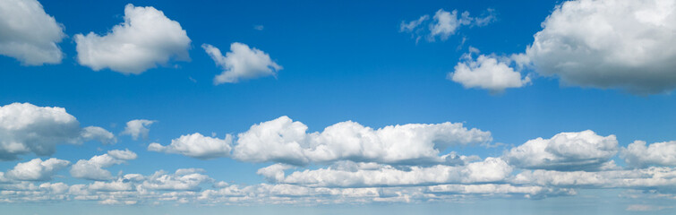 Poofy Clouds in a blue sky