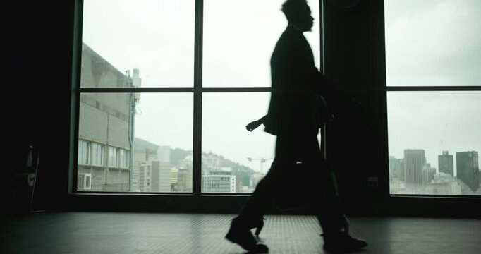 Walking, office and silhouette of woman in window, thinking and agenda in law firm. Female lawyer, colleagues and lobby in building for scheduled meeting, professional and business in workplace
