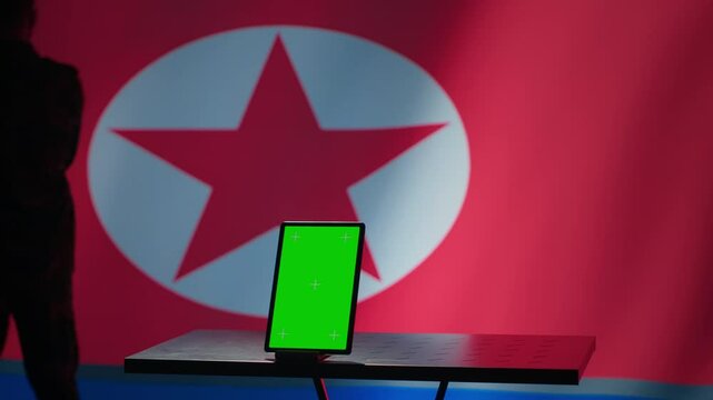 North Korean engineer makes troll accounts with mockup tablet on social media promoting communist ideology. Admin works for Pyongyang regime building algorithms to spread government doctrine, camera A