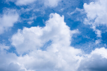 The sky is blue with fluffy white clouds