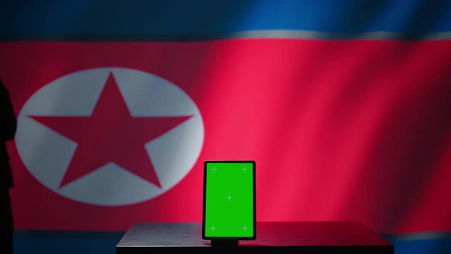 North Korean engineer makes troll accounts with mockup tablet on social media promoting communist ideology. Admin works for Pyongyang regime building algorithms to spread government doctrine, camera B