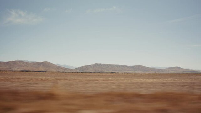 A New Zeland landscape viewed from a moving car 