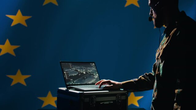 European Union alliance air defense early warning systems operator evaluating incoming enemy aerial attacks. EU counterintelligence division agent maintains air space superiority with radar, camera B