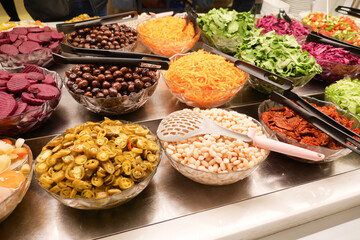 The salad bar offers fresh vegetables and tasty toppings for a diverse and wholesome meal
