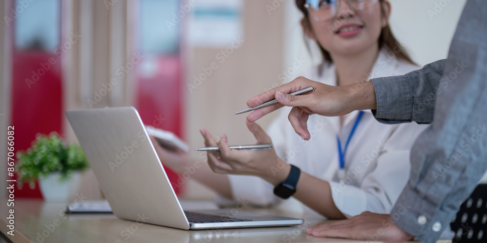 Poster business team analyze data and discuss strategy in a modern office setting with laptop and documents