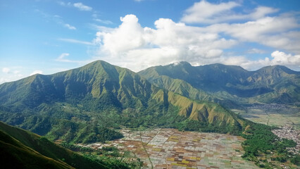 beautiful landscape view green hill at pergasingan hill, lombok island-indonesia. the landscape is for hiking and outdoor lifestyle concept. beautiful natural scenery