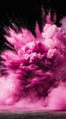 Powerful explosion of magenta colored dust, black background, professional color grading. Beautiful abstract background.