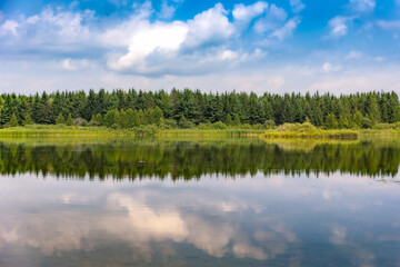 Beautiful reflection of the sky in a lake - Orangeville Reservoir in Island Lake Conservation Area. Ontario Canada