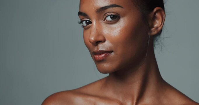 Female person, studio background and makeup with face for skincare, healthy glow or results. Indian woman, confidence or cosmetics on backdrop with attitude for dermatology, aesthetics for wellness