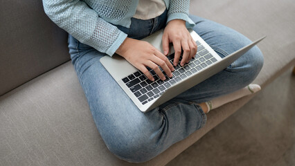 Fototapeta premium Close up hands typing keyboard on labtop. Businesswoman work during technology online connection business.